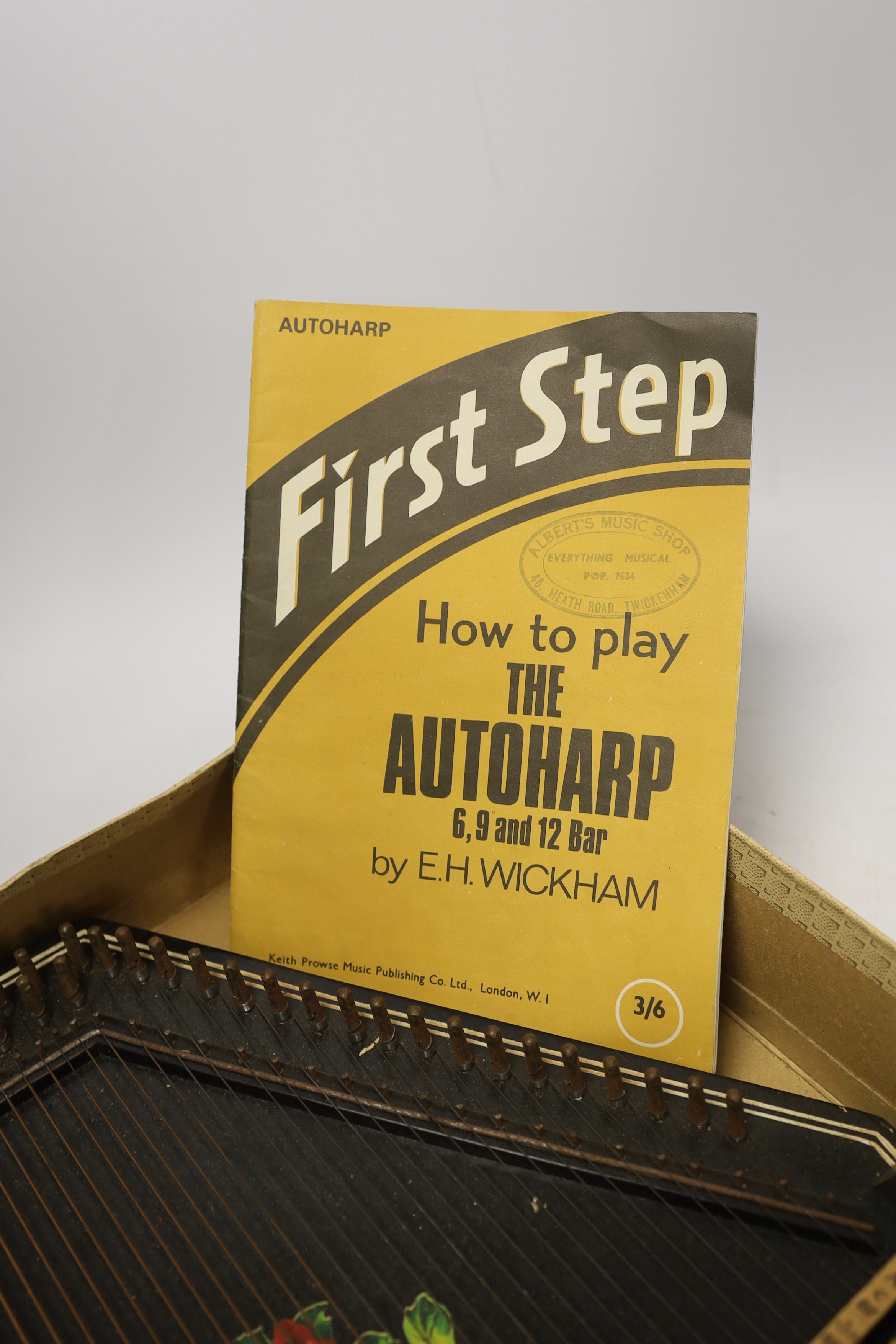 An autoharp in original box with booklet